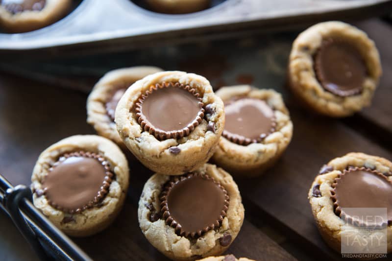 Reeses Peanut Butter Cookies // What's better than just a plain ole cookie cup? One that has a Reese's Peanut Butter Cup in the center! These treats will be gobbled up before you know it. They are delicious! | Tried and Tasty
