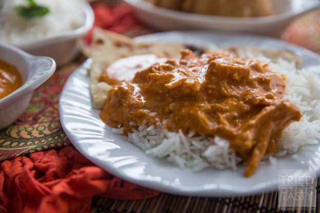 Slow Cooker Easy Indian Butter Chicken // If you have never tried Indian food, this is a MUST MAKE (next to Chicken Tikka Masala). It's made easy with the help of your slow cooker. Packed with flavor, your family will fall in love with the tasty bold flavors! Serve with basmati rice and garlic naan for a delicious traditional meal. | Tried and Tasty