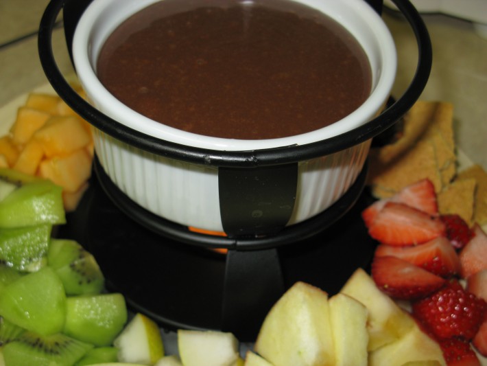 Light and Dark Fondue // The most delicious fondue you'll ever have that's made with Hershey's Hugs! It's smooth and creamy and perfect with any dipper! | Tried and Tasty