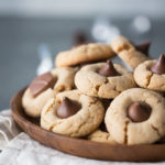 Close up photo of peanut butter cookies with Hershey kisses pressed on top