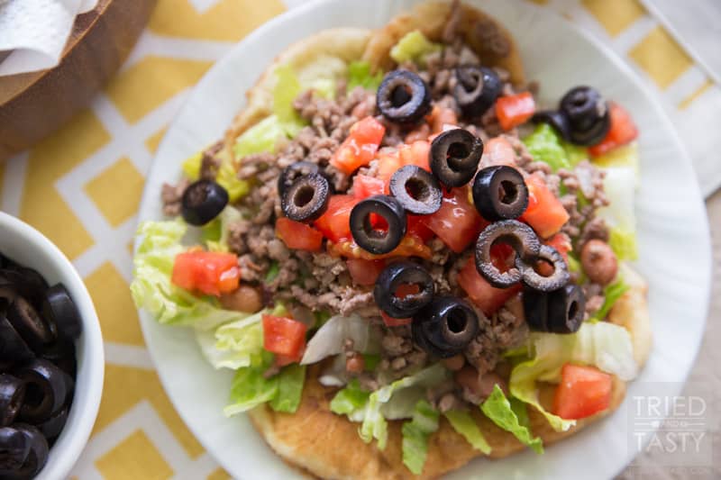 Navajo Tacos // Navajo Tacos are a delicious dinner idea any night of the week. With Rhodes bread, you can have them in a jiffy, just thaw and you're on your way! Garnish with your favorite toppings: lettuce, tomato, olives, cheese, & sour cream! | Tried and Tasty