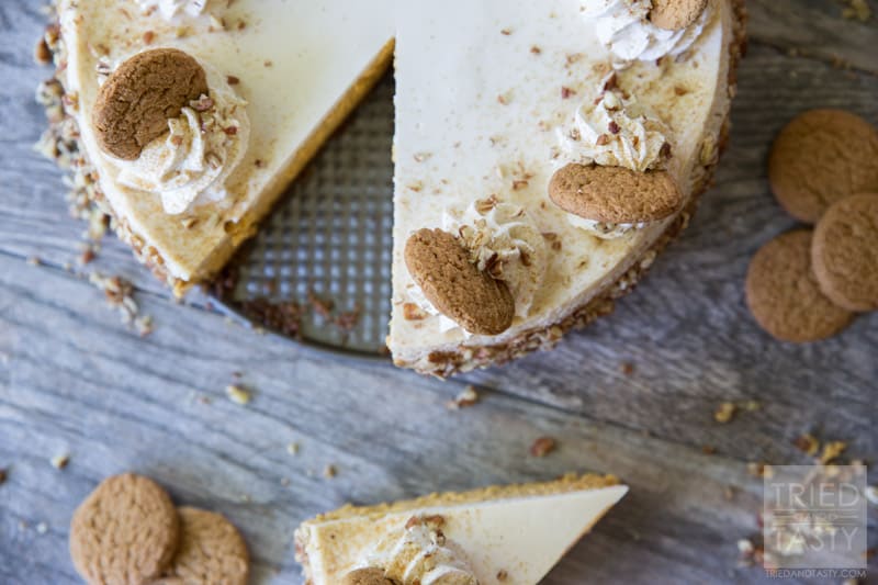 Pumpkin Cheesecake with Gingersnap-Pecan Crust // If you're looking for a light, yet decadent festive desert for the holiday season look no more. This pumpkin cheesecake will quite literally melt in your mouth! Perfectly paired with gingersnaps and pecans it's a dessert you don't want to miss! | Tried and Tasty