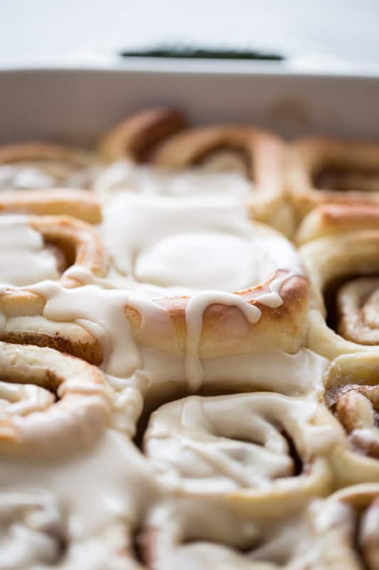 Close up shot of cinnamon rolls with maple icing