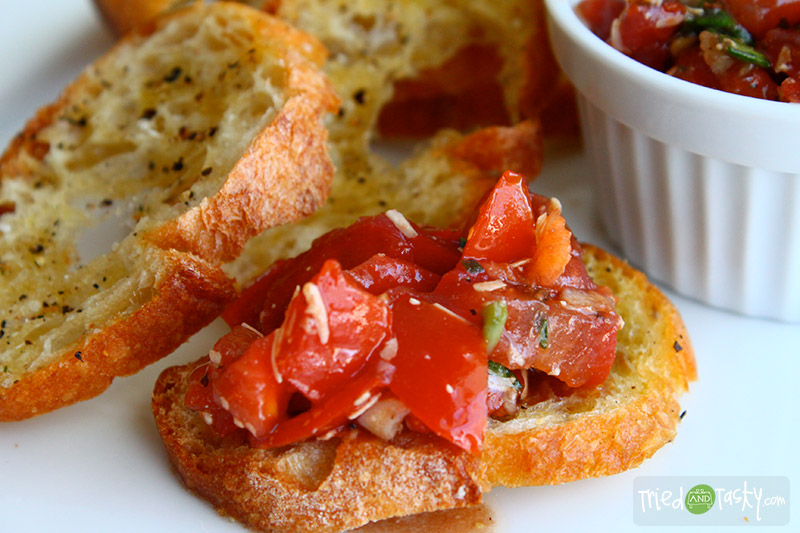 Italian Tomato and Basil Bruschetta // One bite of this bruschetta and you'll be addicted!  It's a great starter to any Italian meal. | Tried and Tasty