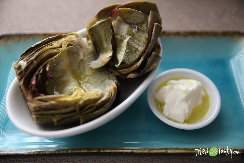 Grilled Artichokes // These grilled artichokes so tasty and pair well with a simple dipping sauce! | Tried and Tasty