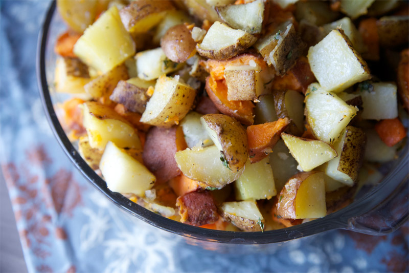 Mixed Roasted Potatoes with Herb Butter // This roasted potatoes recipe has all three of the top favorite: white, red, and sweet potatoes. | Tried and Tasty