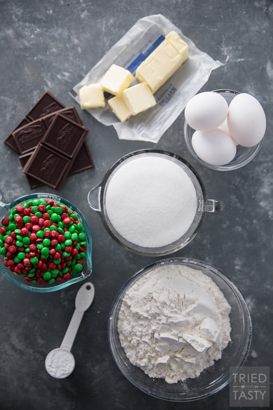Ingredient layout of flour, sugar, eggs, butter, chocolate, M7M's and baking soda