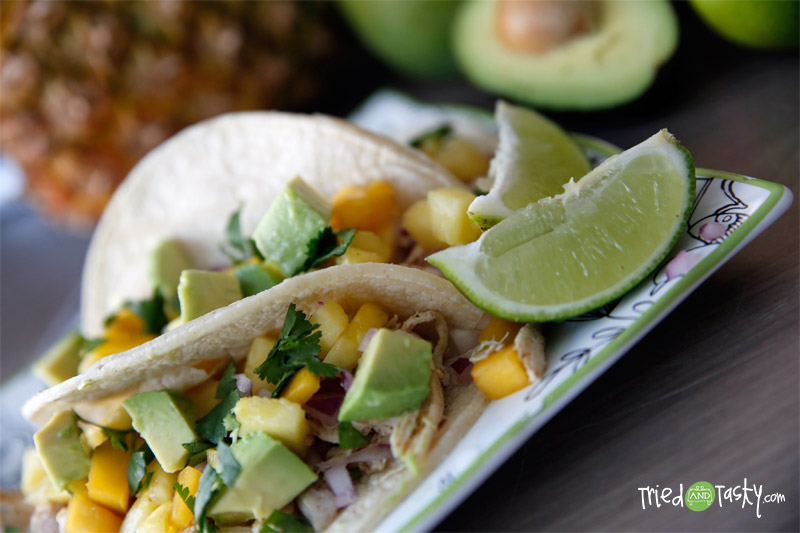 Chicken Tacos with Mango-Pineapple Salsa // These chicken tacos are probably in the top five favorite dish we’ve made to date. They are so light, so fresh, simply put: they are wonderful. Want to know what I love most about them? They are HEALTHY! | Tried and Tasty