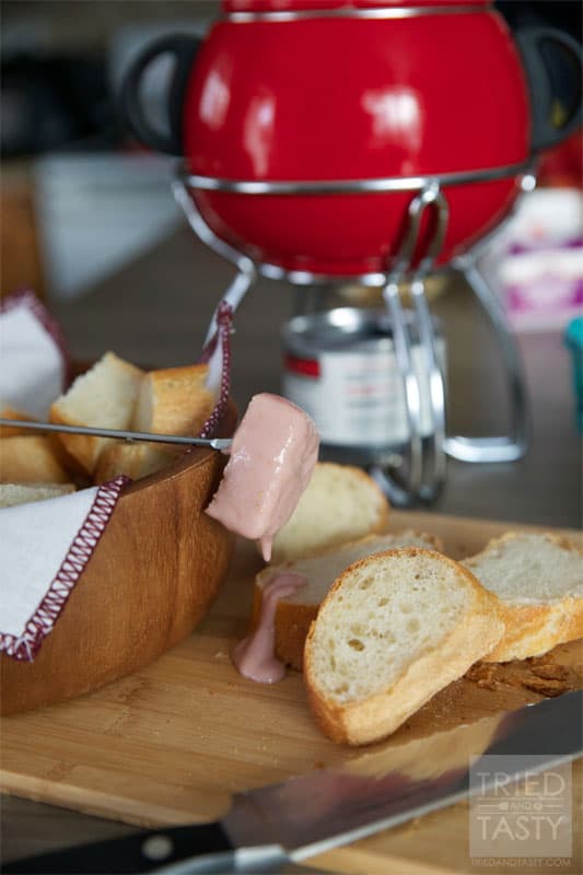 Raspberry Swirl Fondue // This wonderful fondue pairs a delicious creamy cheese with sweet raspberries for an out of this world combination. You'll love the sweet surprise! | Tried and Tasty