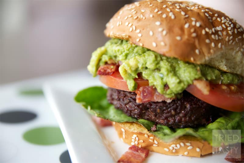 Guacamole Bacon Burger // If you love guacamole, you'll love this burger. It's got the wonderful flavors of guacamole paired with bacon on top of a well-seasoned grilled burger. You won't be disappointed! | Tried and Tasty