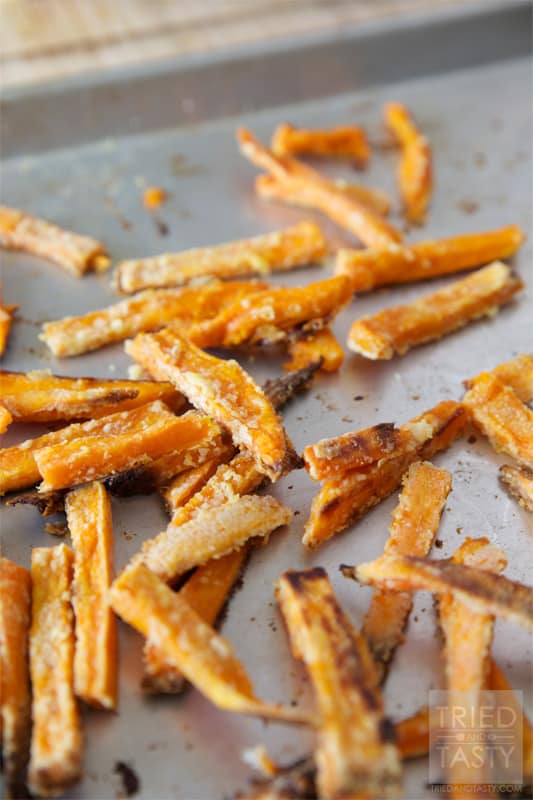 Oven Baked Crispy Sweet Potato Fries // Why buy frozen sweet potatoes when you can make some that are even more amazing? These will change your life! The secret ingredient will leave you pleasantly surprised! | Tried and Tasty