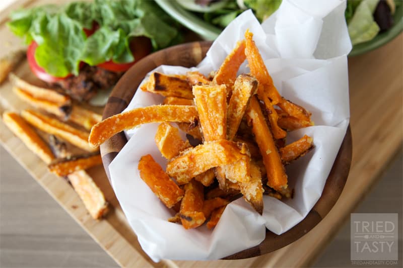 Oven Baked Crispy Sweet Potato Fries // Why buy frozen sweet potatoes when you can make some that are even more amazing? These will change your life! The secret ingredient will leave you pleasantly surprised! | Tried and Tasty