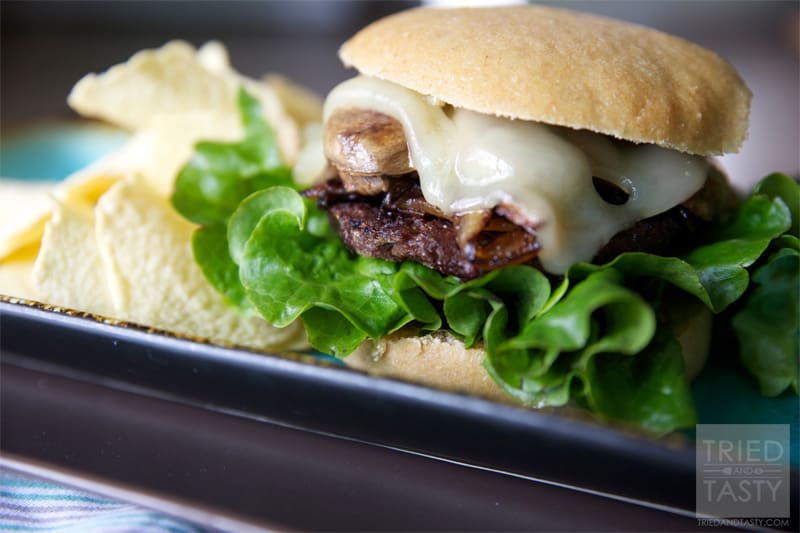 Sauteed Mushroom & Swiss Burger with Caramelized Onions // Nothing goes better with sautéed mushrooms than melty gooey Swiss cheese and a pile of sweet caramelized onions. Put all of that on top of a perfectly grilled burger and you've got yourself a fantastic sandwich! | Tried and Tasty