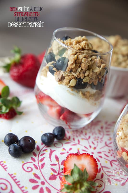 Red White & Blue Strawberry Blueberry Dessert Parfait // What better way to show your patriotism than with this beautiful dessert parfait. The lightly sweetened whipped cream with the fresh berries are wonderfully complimented by the crisp topping. | Tried and Tasty
