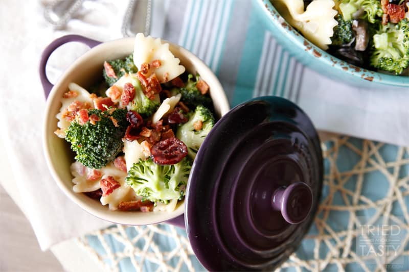Tasty Broccoli Salad with Dried Cranberries // Need a new salad to take to your next get together? This summery broccoli salad will be an instant hit. Slightly sweet with a little bit of tang, finished off with crunchy bacon bits. Delightful!| Tried and Tasty