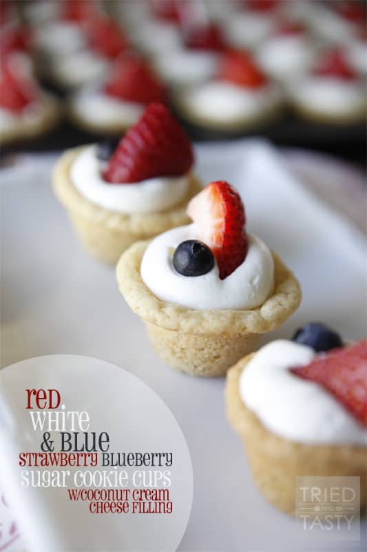 Red White & Blue Strawberry Blueberry Sugar Cookie Cups with Coconut Cream Cheese Filling // These scrumptious little treats are perfect party poppers! They are mini, fit right in the palm of your hand, and will be gobbled up in no time. With the tiniest hint of coconut, you'll be left wanting more! | Tried and Tasty