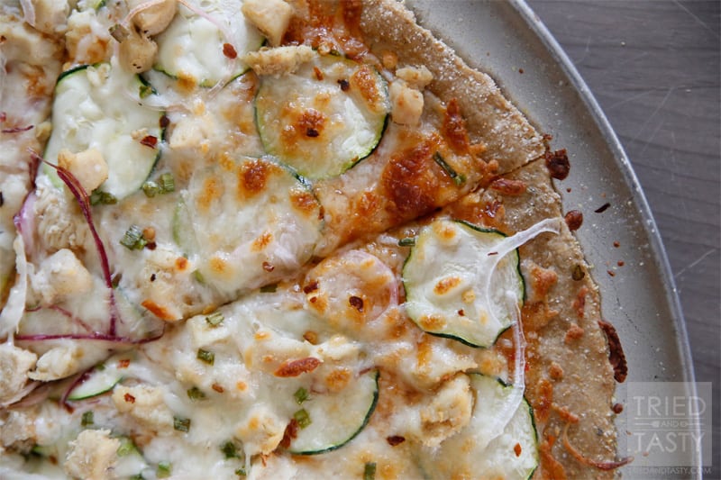 Thin Style Thai Chicken Pizza // Looking for a new way to experience pizza? This is a game changer! You've got to try the sweet sauce paired with garden fresh veggies, chicken, and of course cheese. Delightful! | Tried and Tasty