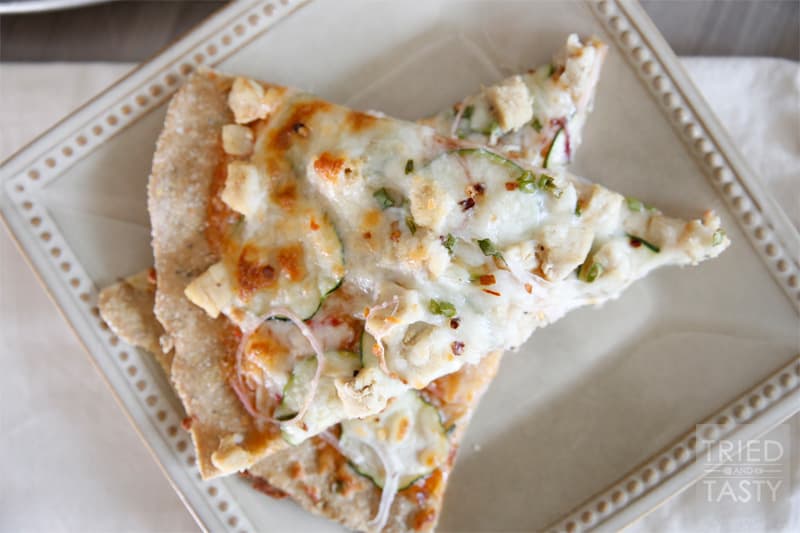 Thin Style Thai Chicken Pizza // Looking for a new way to experience pizza? This is a game changer! You've got to try the sweet sauce paired with garden fresh veggies, chicken, and of course cheese. Delightful! | Tried and Tasty