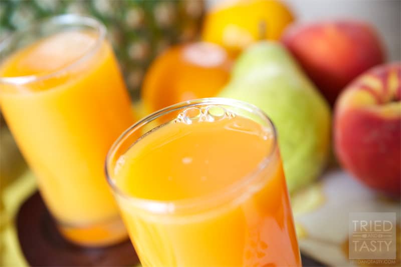 Sippable Orange Sunshine // This Sippable Orange Sunshine is truly like sipping on sunshine. A whole slew of your favorite fruits (and a vegetable) get thrown together for this delicious concoction! | Tried and Tasty