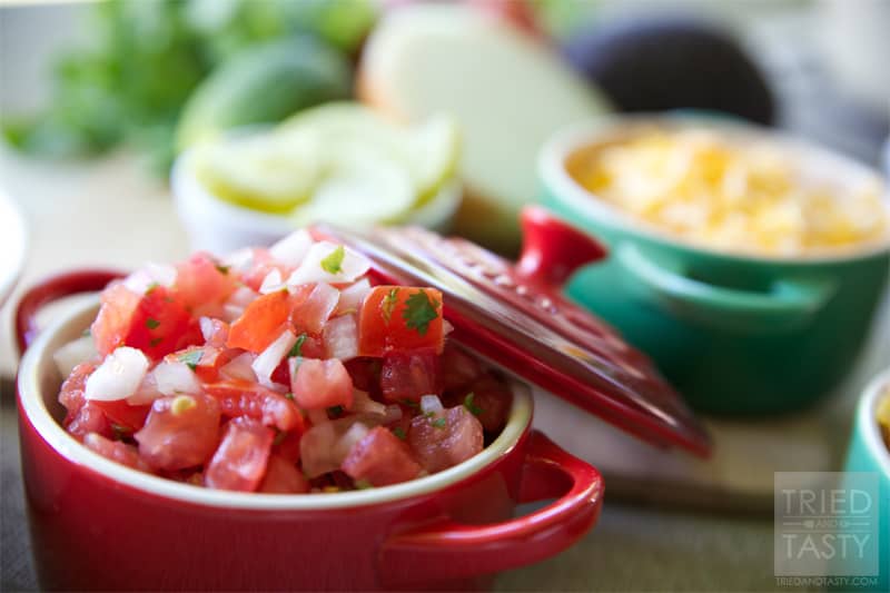 Pico de Gallo // Similar to salsa, Pico De Gallo is a fantastic condiment that can be served with any of your favorite Mexican dishes. Great as a topping on tacos, enchiladas, or salads. Perfect served with chips! Any way you dice it, this flavorful combo will add just what you need to your meal! | Tried and Tasty