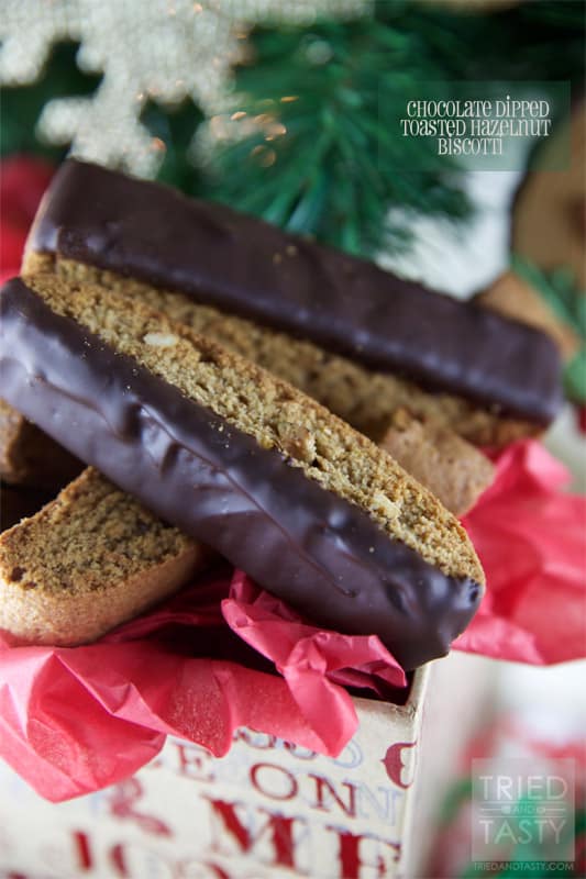 Chocolate Dipped Toasted Hazelnut Biscotti // A great cookie delicious served with your favorite warm drink. Perfectly paired with coffee or hot chocolate, but excellent alone as well! A great treat for the holidays, ideal for neighbors, co-workers, and friends! | Tried and Tasty