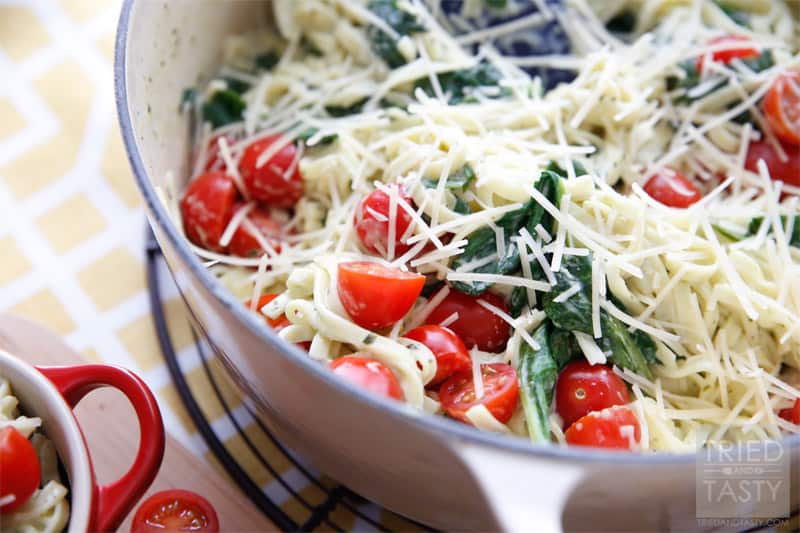 Creamy Spinach Tomato Linguine // A fantastic weeknight meal that you can throw together in a cinch, but looks like you spent hours in the kitchen! The wonderful flavors marry so well together. Tastes great with a slice of your favorite bread! | Tried and Tasty