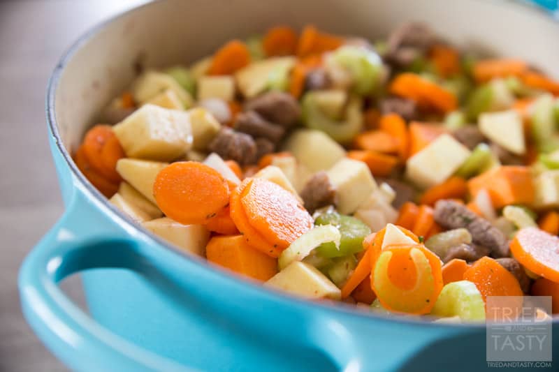 Sweet Potato Beef Stew // This sweet potato stew is made perfectly slow cooker style in the Le Creuset 5 1/2 Qt. French Oven. A handful of healthy ingredients make for a delicious hearty and healthy meal. // Tried and Tasty