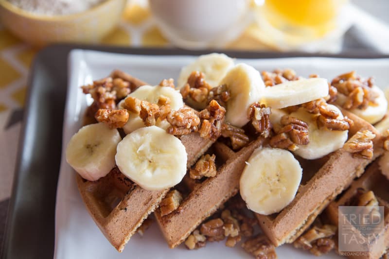 Gluten Free Banana Nut Waffles // These healthy & delicious waffles are the perfect way to start your morning. Made with oat flour, you can have your favorite waffles without any wheat! Topped with maple candied pecans and bananas, they are a treat you don't want to miss! | Tried and Tasty