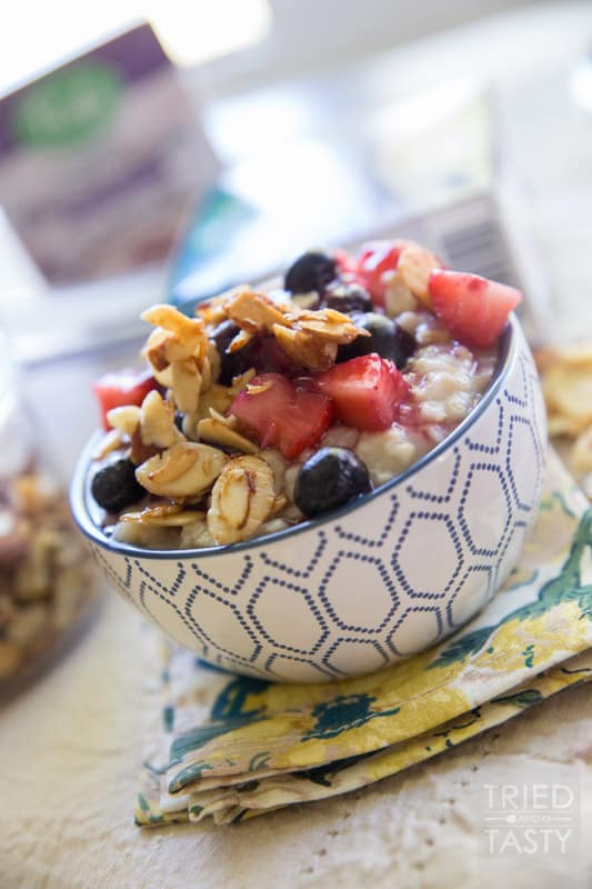 Nuts About Berries Oatmeal // Spice up your breakfast routine with this delicious oatmeal! Topped with fresh berries, warm berry compote, and maple candied almonds. An excellent and hearty way to start your day! |Tried and Tasty