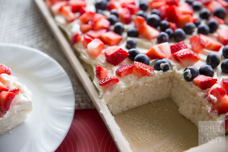 Berries 'n Cream Cheese Cake // Looking for a light, delicious, and EASY treat to feed a crowd? This sheet cake is perfect for parties, family gatherings, BBQ's and potlucks! You'll be amazed at how simple it is to put together! | Tried and Tasty