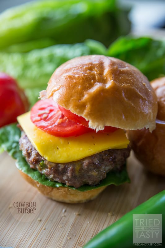 Cowboy Burger // Grilling doesn't have to be boring. In fact, it can make for some of the best grub you've ever had! These Cowboy Burgers are loaded with flavor. Best part about it? You can keep the heat if you like 'em spicy or ditch the heat if you like a milder flavor. All you have to do is adjust the jalapeno seed accordingly! Add these to your grilling menu immediately! | Tried and Tasty