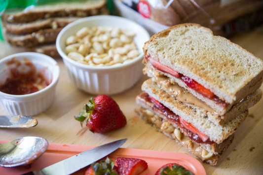 The Ultimate Strawberry PB&J // Who says peanut butter and jelly sandwiches have to be boring? This double-decker knockout creation has two extra special add-ins. Come see what they are and how to make this mouth-watering pb&j! | Tried and Tasty