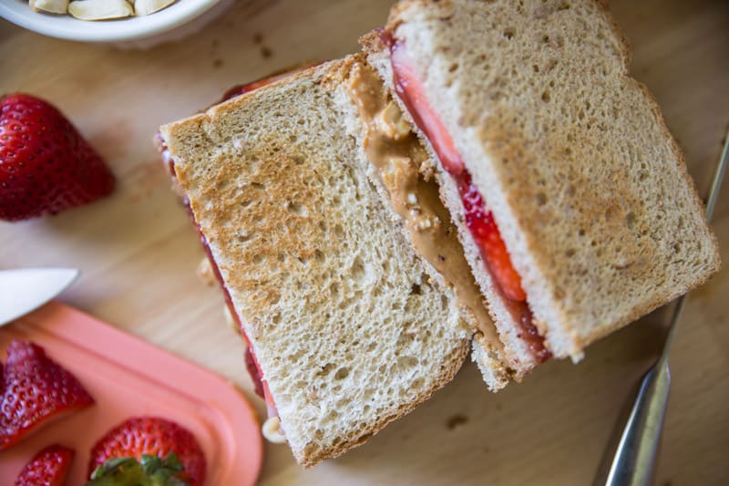The Ultimate Strawberry PB&J // Who says peanut butter and jelly sandwiches have to be boring? This double-decker knockout creation has two extra special add-ins. Come see what they are and how to make this mouth-watering pb&j! | Tried and Tasty