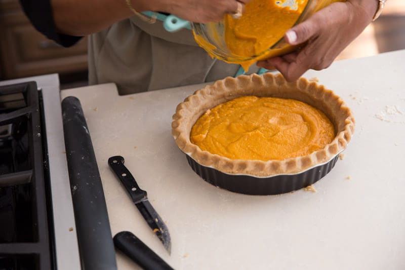 Mom's Sweet Potato Pie // This sweet potato pie is legendary and has been passed down from my grandfather and grandmother to my own mother and now to me. This is the MUST HAVE recipe of the fall season that can be enjoyed for Halloween, Thanksgiving, and any other day of the year! The perfect addition to any dessert table. | Tried and Tasty
