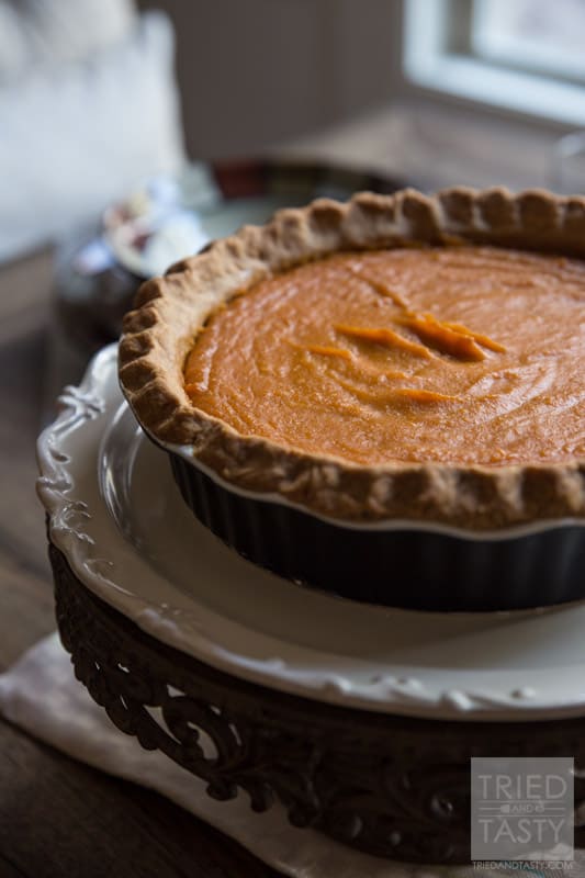 Mom's Sweet Potato Pie // This sweet potato pie is legendary and has been passed down from my grandfather and grandmother to my own mother and now to me. This is the MUST HAVE recipe of the fall season that can be enjoyed for Halloween, Thanksgiving, and any other day of the year! The perfect addition to any dessert table. | Tried and Tasty