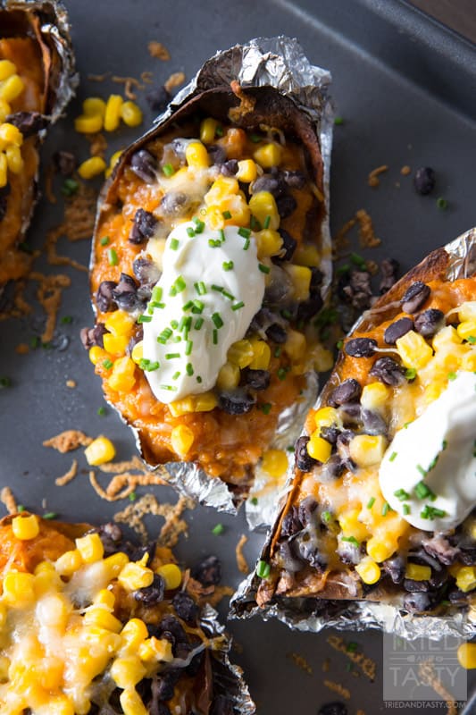 Southwestern Sweet Potato Skins // Looking for a delicious snack to 'lighten up' your Monday Night Football get togethers? These delicious skins are perfect! Made with only a few wholesome ingredients, you'll wonder where these have been all your life! #MeatlessMondayNight | Tried and Tasty