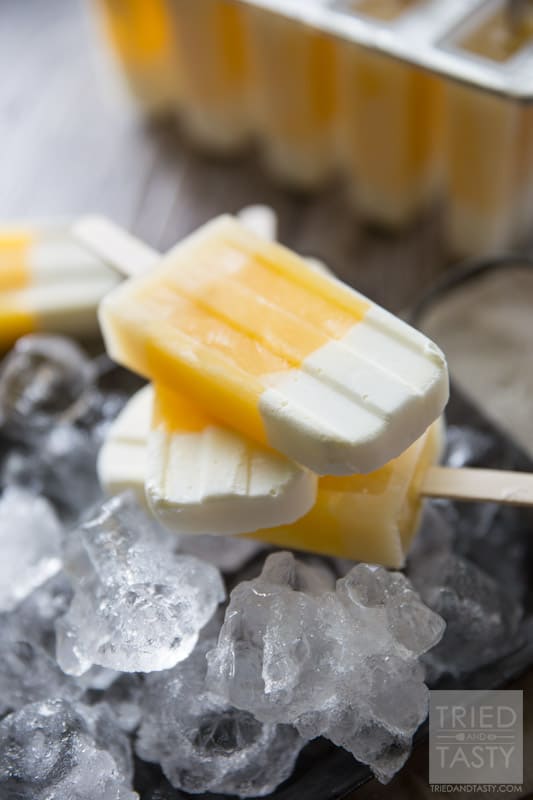 Tropical Candy Corn Popsicles // This 'candy corn' inspired treat is a healthy variation for all of your guilt-free treat needs! Perfectly tropcial with the flavors of coconut, pineapple and orange you're tastebuds will say THANK YOU! | Tried and Tasty