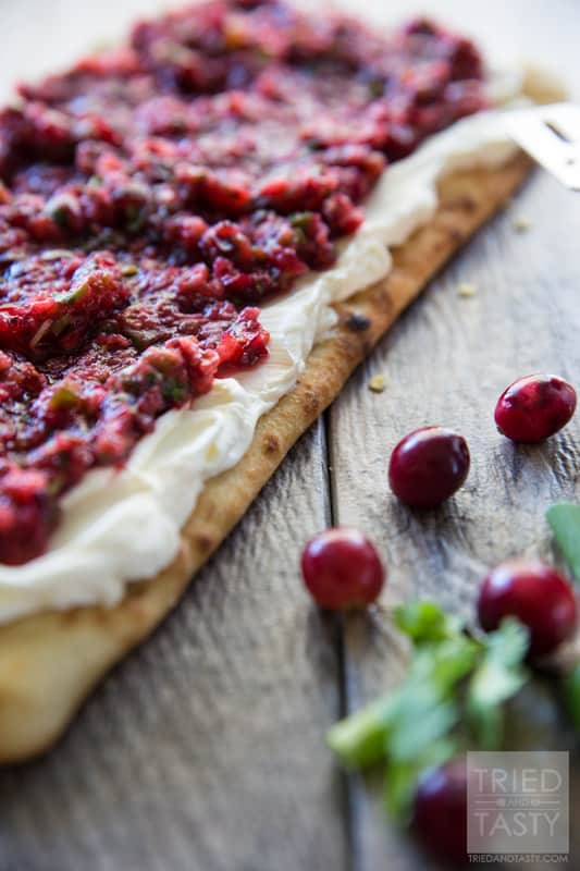 Cranberry Salsa Flatbread Appetizer // Want a delicious & festive appetizer for the holidays? You're in luck! This cranberry salsa will wow your guests tastebuds at first bite! | Tried and Tasty