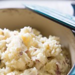 Dutch Oven Mashed Potatoes // Looking for a delicious but healthier mashed potato recipe? These out-of-this-world potatoes are made with only 4 ingredients and you won't believe the secret ingredient that makes them perfectly creamy! | Tried and Tasty