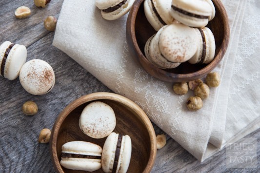 Classic French Macarons with Homemade Nutella Filling // These tasty little one-bite treats are made ever so slightly healthier with a homemade Nutella center. Crispy. Dainty. Delicious | Tried and Tasty