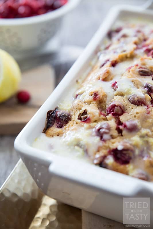 Lemon Cranberry Bread // This gorgeous citrus sweet bread is not only a stunner, but perfect for your holiday dessert table. A little bit of tart, a little bit of sweet, and a whole lot of delicious! | Tried and Tasty