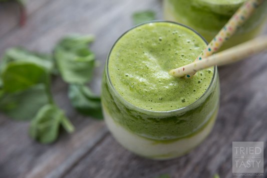 Pineapple Banana Layered Green Smoothie // Not quite ready to take the leap into the world of green smoothies? Try this layered version with a mix of pineapple and banana frozen goodness. The flavors combine to make an out-of-this-world blended drink! | Tried and Tasty