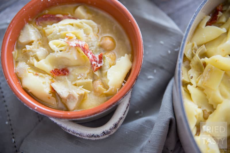Tortellini & Artichoke Soup // This simple soup is both filling and surprisingly a healthy comfort food. You'll never believe the secret ingredient helping make it 'lighter'. Enjoy this warm bowl of goodness to heat you from the inside out! | Tried and Tasty