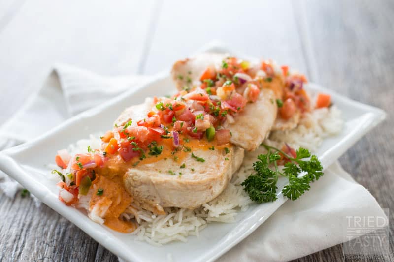 Bruschetta Chicken // Looking for a delicious diner idea for that someone special in your life? This chicken is super easy to whip together and wonderfully tasty. Plus, check out a few other great recipes that will pair nicely to make an entire romantic dinner! | Tried and Tasty
