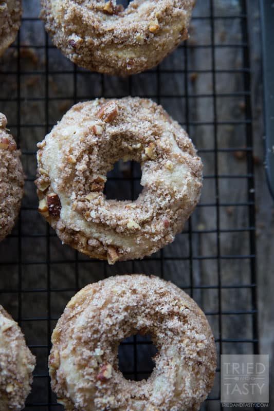 Baked Coffee Cake Doughnuts // You love coffee cake, but do you love coffee cake DOUGHNUTS? The answer is yes. I know. You haven't tried them yet. The answer is still yes. These delicious doughnuts pair perfectly with your coffee for breakfast in the morning. They are a cinch to whip together and will be gone before you know it (better make a double batch to begin with!) | Tried and Tasty