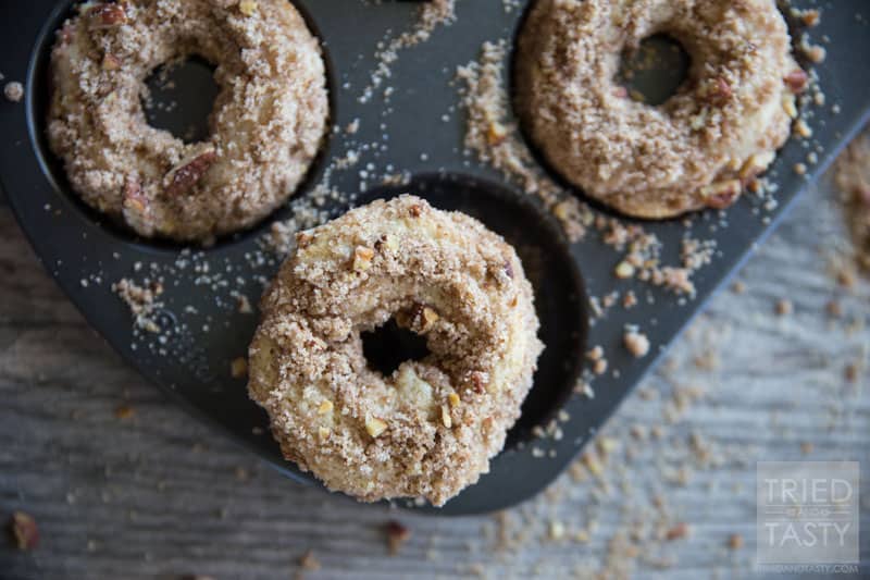 Baked Coffee Cake Doughnuts // You love coffee cake, but do you love coffee cake DOUGHNUTS? The answer is yes. I know. You haven't tried them yet. The answer is still yes. These delicious doughnuts pair perfectly with your coffee for breakfast in the morning. They are a cinch to whip together and will be gone before you know it (better make a double batch to begin with!) | Tried and Tasty