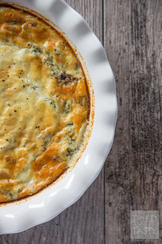 Spinach Artichoke Parmesan Breakfast Pie // Some of your favorite flavors have all been combined into one in this delicious breakfast pie. Spinach, artichoke AND Parmesan are the staples for this delicious meal special enough for a holiday brunch but easy enough for breakfast anytime! | Tried and Tasty