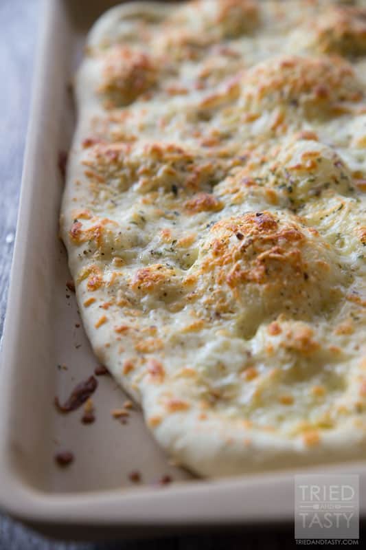 Two Cheese Focaccia // This delicious bread is not only quick & easy, but perfect all by itself OR great to make sandwiches with! Whip this together in no time at all, throw together a turkey & avocado sandwich, then enjoy the perfect lunch! | Tried and Tasty