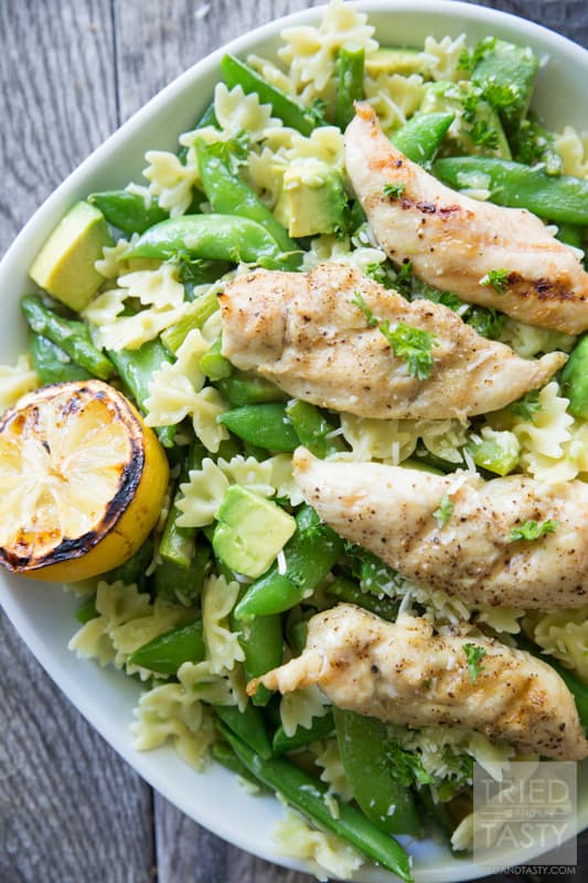 Asparagus, Snap Pea, and Avocado Pasta // This delicious pasta served with grilled chicken and lemon is the perfect dish to serve for any special occasion. Avocado lovers will swoon over the smooth, creamy, and flavorful incorporation into this tasty dinner idea! | Tried and Tasty