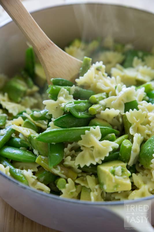 Hot Asparagus, Snap Pea, and Avocado Pasta Salad// This delicious pasta served with grilled chicken and lemon is the perfect dish to serve for any special occasion. Avocado lovers will swoon over the smooth, creamy, and flavorful incorporation into this tasty dinner idea! | Tried and Tasty